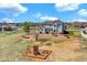 Backyard aerial view showcasing the patio and a playground set at 16680 Stroilway St, Hudson, CO 80642