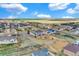 Panoramic aerial showing neighborhood houses, open land, and nearby community amenities at 16680 Stroilway St, Hudson, CO 80642
