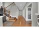 Inviting foyer with a wood staircase, slate-look tile flooring, and multiple doors leading to different areas of the home at 16680 Stroilway St, Hudson, CO 80642