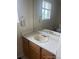 Bathroom featuring a sink with wood cabinets at 19939 Mitchell Cir, Denver, CO 80249