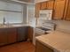 Bright kitchen with stainless steel appliances, granite countertops, and wooden cabinets at 19939 Mitchell Cir, Denver, CO 80249