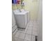 Efficient laundry room equipped with a washer, dryer, and storage shelves at 19939 Mitchell Cir, Denver, CO 80249