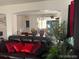 Living room with a leather couch and dining room view at 19939 Mitchell Cir, Denver, CO 80249