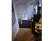View of a room with a white sofa and small refrigerator at 19939 Mitchell Cir, Denver, CO 80249