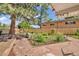 Beautiful backyard with a stone patio, garden area, and a wooden fence at 1830 Zang St, Golden, CO 80401