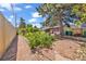 Expansive backyard featuring a stone path, lush greenery, and privacy fencing, perfect for outdoor enjoyment and relaxation at 1830 Zang St, Golden, CO 80401