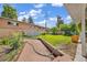 Spacious backyard features a stone patio, lush lawn, and storage shed at 1830 Zang St, Golden, CO 80401
