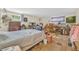 Bedroom with full bed, hardwood-style flooring, and lots of furniture at 1830 Zang St, Golden, CO 80401