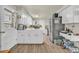 Spacious eat-in kitchen with white cabinetry and modern stainless steel appliances at 1830 Zang St, Golden, CO 80401
