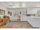 Bright kitchen space with white cabinets, wood look flooring, and natural light at 1830 Zang St, Golden, CO 80401