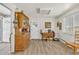 Bright kitchen and dining area with classic wooden furniture and ample cabinet space at 1830 Zang St, Golden, CO 80401