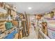 Storage room with boxes, wood flooring, and doorway at 1830 Zang St, Golden, CO 80401