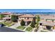 Areal view of homes, showcasing the tile roofs, neighborhood, landscaping and mountain view at 10783 Skydance Dr, Highlands Ranch, CO 80126