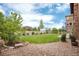 Beautiful backyard with lush green lawn and professional landscaping at 10783 Skydance Dr, Highlands Ranch, CO 80126