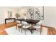 Bright dining area offers hardwood floors and modern decor creating a welcoming atmosphere at 10783 Skydance Dr, Highlands Ranch, CO 80126