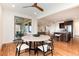 Cozy dining room area with stylish furnishings and seamless access to both the kitchen and outdoor patio at 10783 Skydance Dr, Highlands Ranch, CO 80126