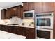 Well-equipped kitchen featuring stainless steel appliances, modern cabinetry, and granite countertops for a sleek cooking experience at 10783 Skydance Dr, Highlands Ranch, CO 80126