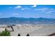 Expansive mountain range views stretching across the horizon from this home's rooftop at 10783 Skydance Dr, Highlands Ranch, CO 80126