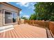 Spacious wooden deck perfect for outdoor entertaining with great natural light at 502 Ledge St, Brighton, CO 80603