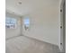 Bright bedroom with carpet and two windows letting in natural light at 502 Ledge St, Brighton, CO 80603