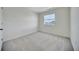 Bright bedroom featuring carpeted floors and a window at 502 Ledge St, Brighton, CO 80603