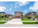 Charming two-story home with a well-manicured lawn and attached two-car garage at 502 Ledge St, Brighton, CO 80603