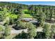 Aerial view of the home surrounded by dense forest and winding roads at 1688 Pine Valley Rd, Evergreen, CO 80439