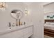Modern bathroom with double sink vanity, sleek fixtures, and bright lighting at 1688 Pine Valley Rd, Evergreen, CO 80439