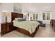 Spacious main bedroom with vaulted ceilings, large windows, and elegant furnishings at 1688 Pine Valley Rd, Evergreen, CO 80439