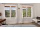 Bedroom showcasing large windows with scenic views of the surrounding mountain landscape at 1688 Pine Valley Rd, Evergreen, CO 80439