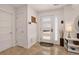 Inviting foyer with modern door, travertine floor, and elegant decor at 1688 Pine Valley Rd, Evergreen, CO 80439