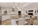 Bright, open kitchen featuring a large island, granite countertops, and stainless steel appliances at 1688 Pine Valley Rd, Evergreen, CO 80439