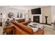 Comfortable living room with stone fireplace, recessed lights, and stylish furnishings at 1688 Pine Valley Rd, Evergreen, CO 80439