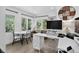 Bright home office featuring large windows with natural light and stylish decor at 1688 Pine Valley Rd, Evergreen, CO 80439