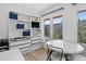 Office featuring modern furniture, built-in shelves, and scenic views from large windows at 1688 Pine Valley Rd, Evergreen, CO 80439