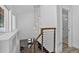 Modern staircase featuring an open design with wood and steel railings and hanging pendant lights at 1688 Pine Valley Rd, Evergreen, CO 80439