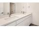 Bathroom with double vanity and quartz countertop at 1236 S Algonquian St, Aurora, CO 80018