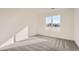 Spacious bedroom with gray carpeting and a large window at 1236 S Algonquian St, Aurora, CO 80018