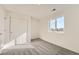 Bright bedroom featuring gray carpeting and double door closet at 1236 S Algonquian St, Aurora, CO 80018