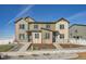 Modern two-story townhome with landscaped front yard and neutral color palette at 1236 S Algonquian St, Aurora, CO 80018