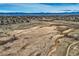 Stunning aerial view of the city, showcasing the landscape, mountain views, and a serene marshland at 7157 S Niagara Ct, Centennial, CO 80112
