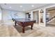 Basement area with a ping pong table and a map on the wall offers space for entertainment and relaxation at 7157 S Niagara Ct, Centennial, CO 80112