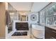 Bright bathroom with soaking tub, modern vanity and designer fixtures at 7157 S Niagara Ct, Centennial, CO 80112