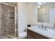 Bathroom features a modern vanity, updated fixtures and tiled shower at 7157 S Niagara Ct, Centennial, CO 80112