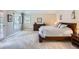 Inviting bedroom with a large bed, dresser, and access to a private balcony with scenic views at 7157 S Niagara Ct, Centennial, CO 80112
