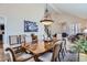 Formal dining area with a vaulted ceiling and a large wood table set for a meal at 7157 S Niagara Ct, Centennial, CO 80112