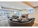 Finished basement features living area with brick fireplace and sliding glass door at 7157 S Niagara Ct, Centennial, CO 80112