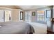 Spacious main bedroom featuring high ceilings, balcony access, neutral carpet and an ensuite bath at 7157 S Niagara Ct, Centennial, CO 80112