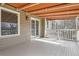 Charming covered porch with an orange awning offering a cozy outdoor space with ample natural light at 7157 S Niagara Ct, Centennial, CO 80112