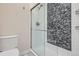 Updated bathroom with glass enclosed shower and mosaic tile accent wall at 7157 S Niagara Ct, Centennial, CO 80112